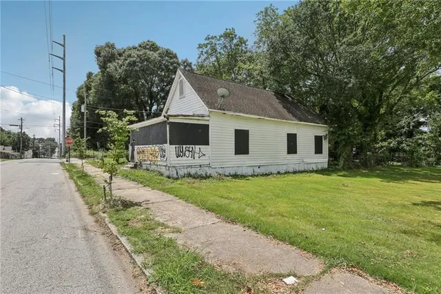 a front view of a house with yard