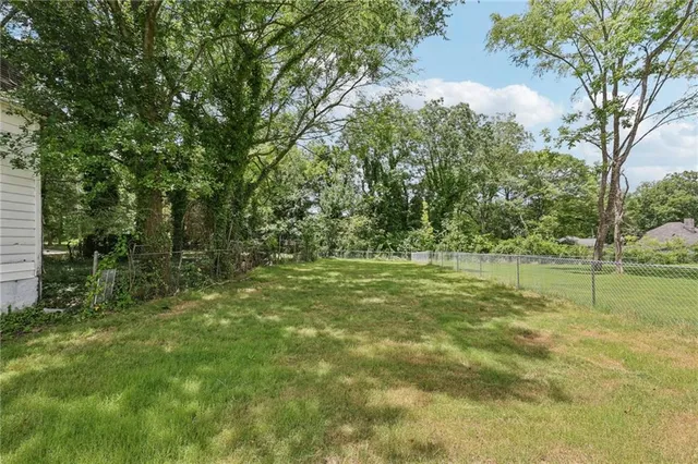 a view of outdoor space with trees all around
