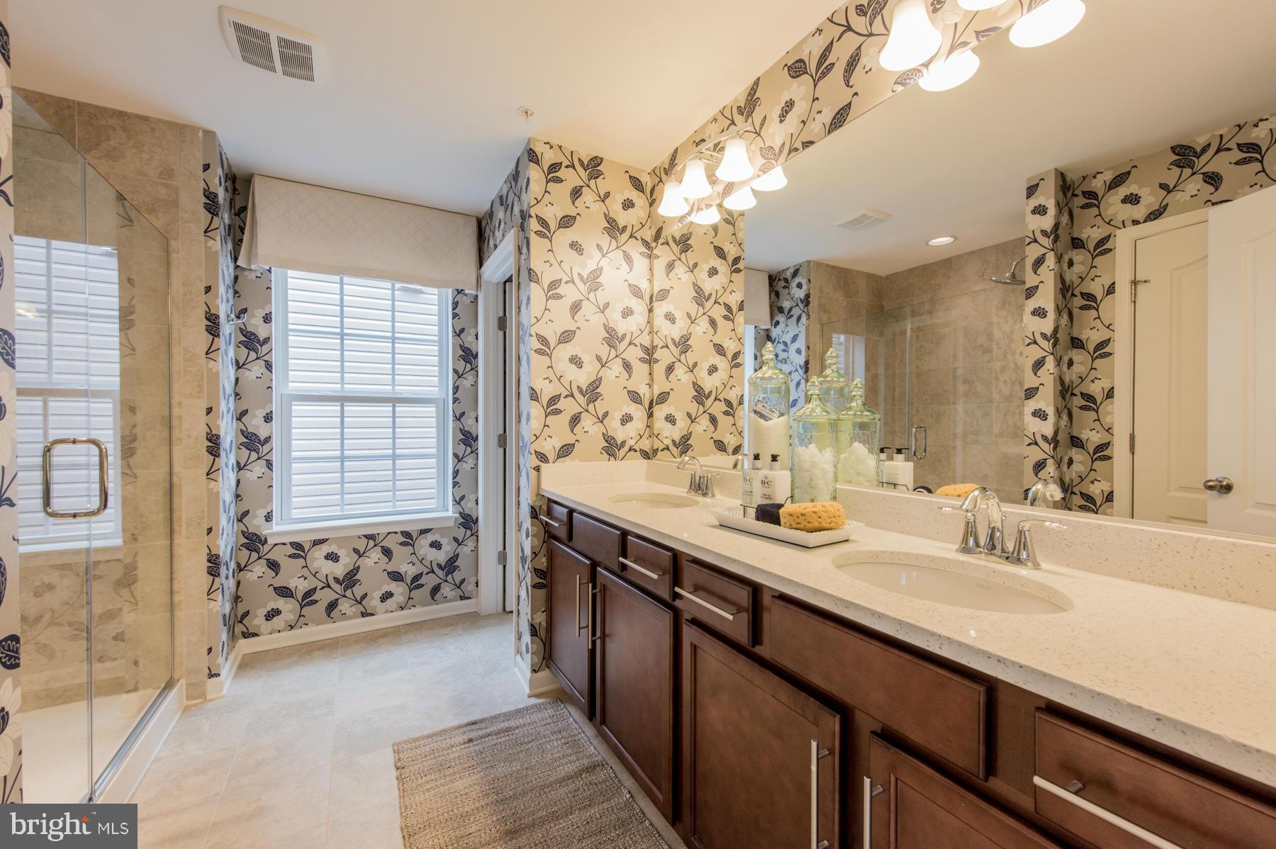 10540 Braddock Run Road Middle River, MD 21220 - Photo 22 of 30 a bathroom with a sink double vanity and a shower