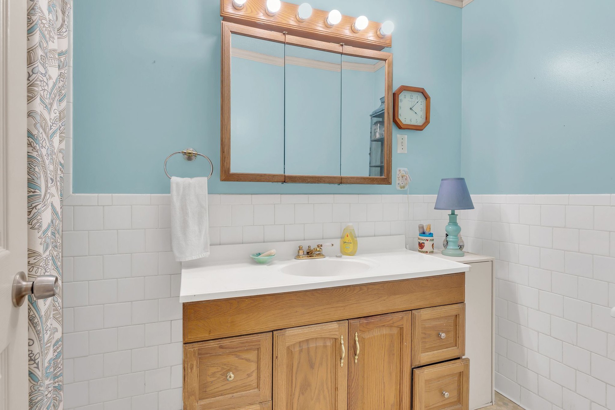 999 Sixteenth Model Road Manchester, TN 37355 - Photo 17 of 24 a bathroom with a sink a vanity and a mirror