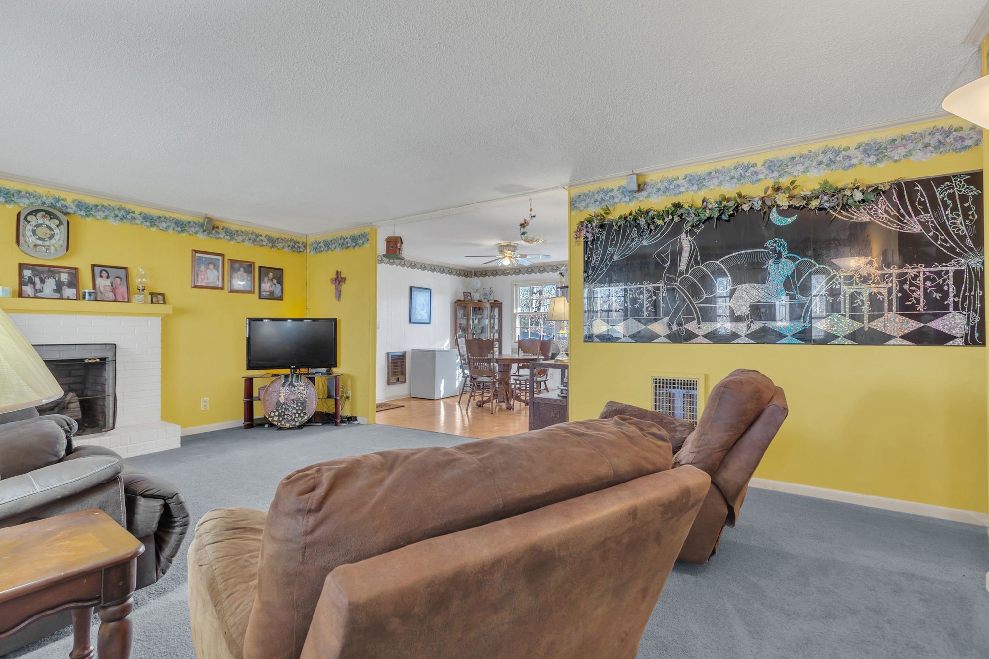 999 Sixteenth Model Road Manchester, TN 37355 - Photo 7 of 24 a living room with furniture a flat screen tv and a large window
