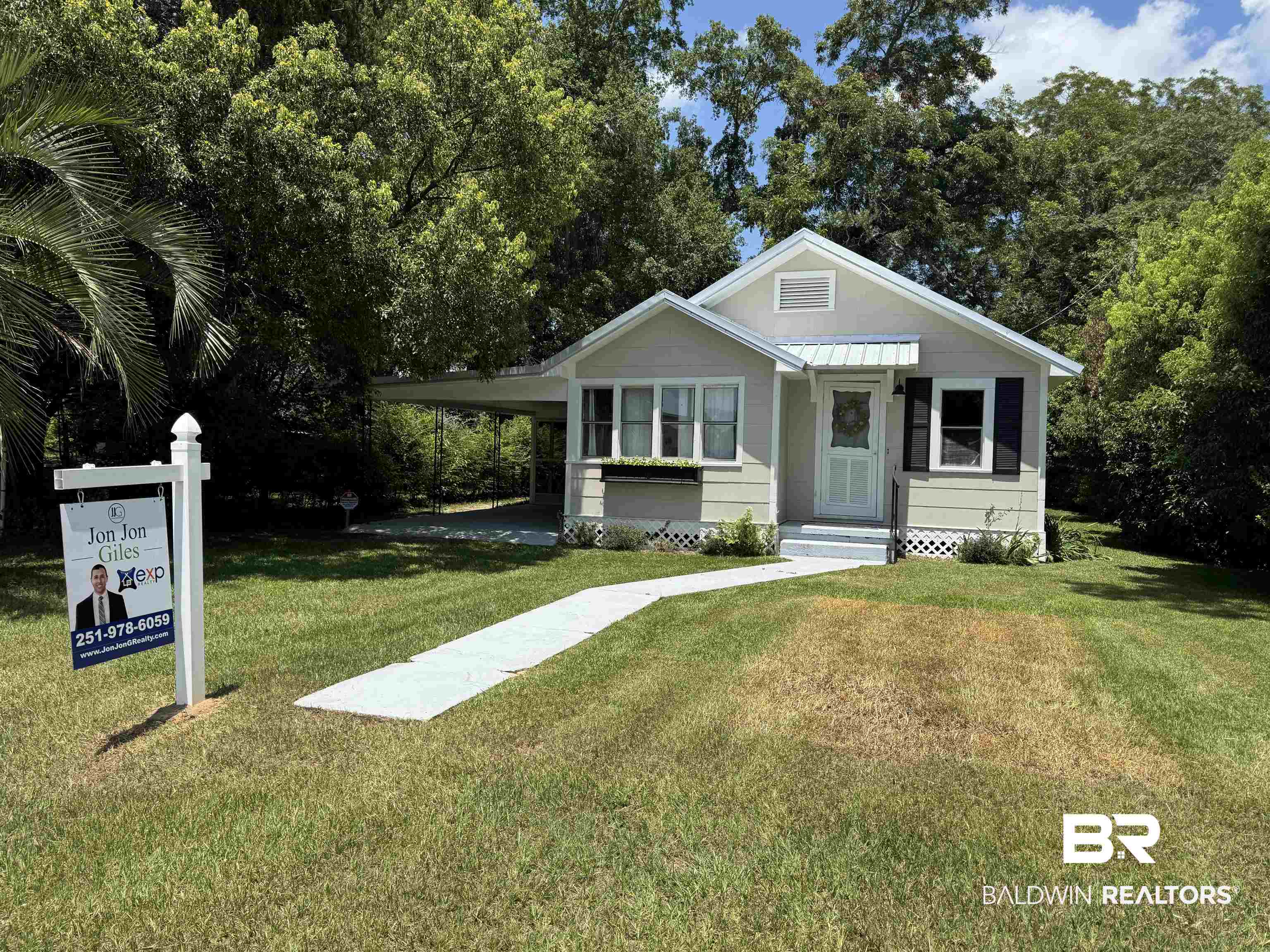 22640 Racine Street Robertsdale, AL 36567 - Photo 4 of 40 View of front of house with an attached carport and a front lawn