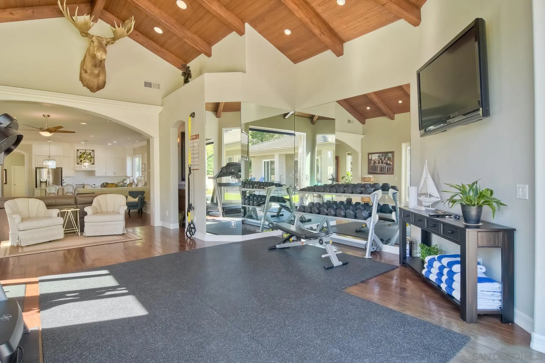 11739 Treadwell Drive Poway, CA 92064 - Photo 15 of 46 a living room with fireplace furniture and a flat screen tv