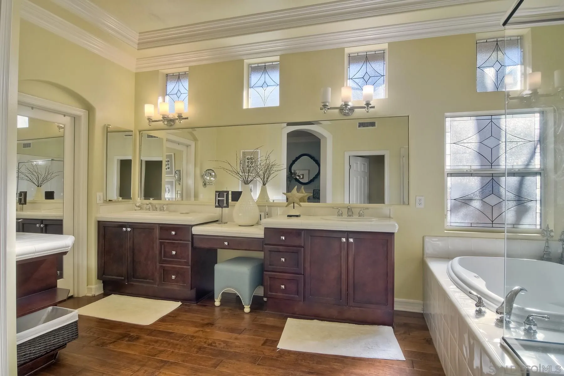11739 Treadwell Drive Poway, CA 92064 - Photo 23 of 46 a spacious bathroom with a granite countertop tub sink and mirror