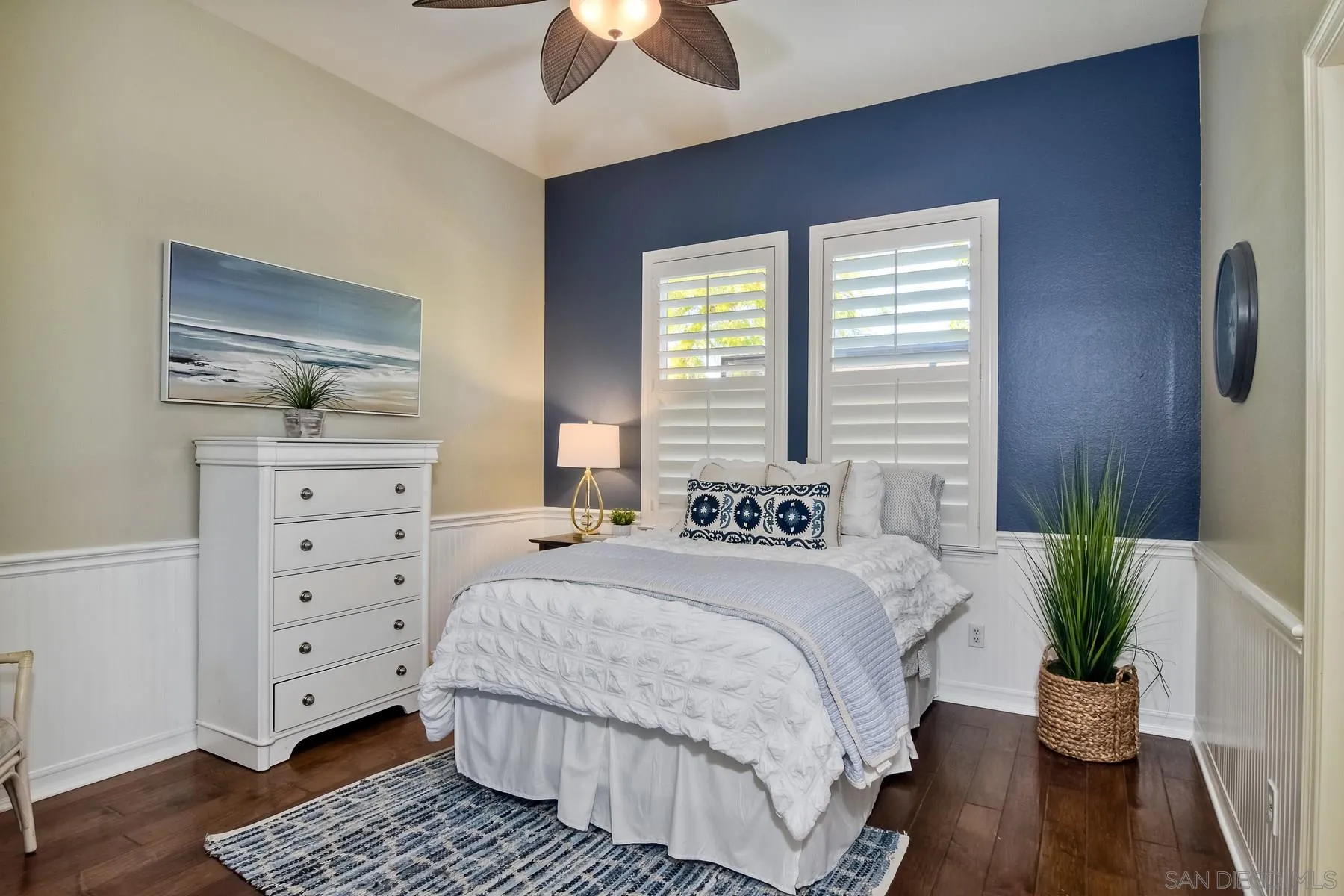 11739 Treadwell Drive Poway, CA 92064 - Photo 27 of 46 a bedroom with a bed and a chandelier