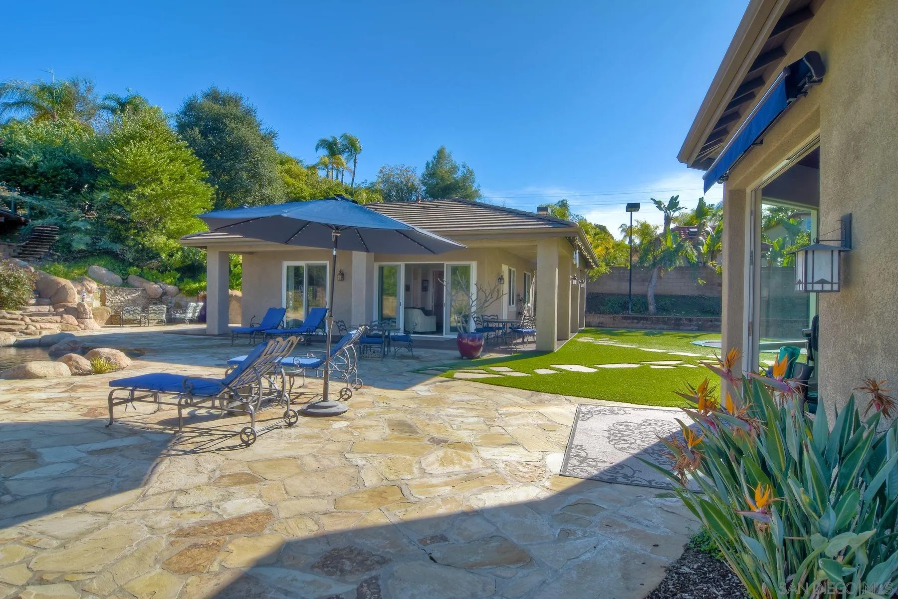 11739 Treadwell Drive Poway, CA 92064 - Photo 32 of 46 a view of a house with backyard porch and sitting area