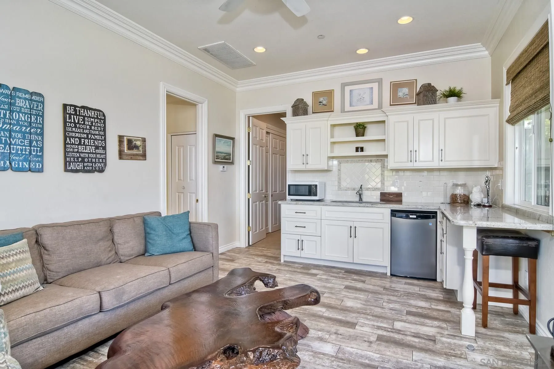 11739 Treadwell Drive Poway, CA 92064 - Photo 34 of 46 a living room with furniture and kitchen view