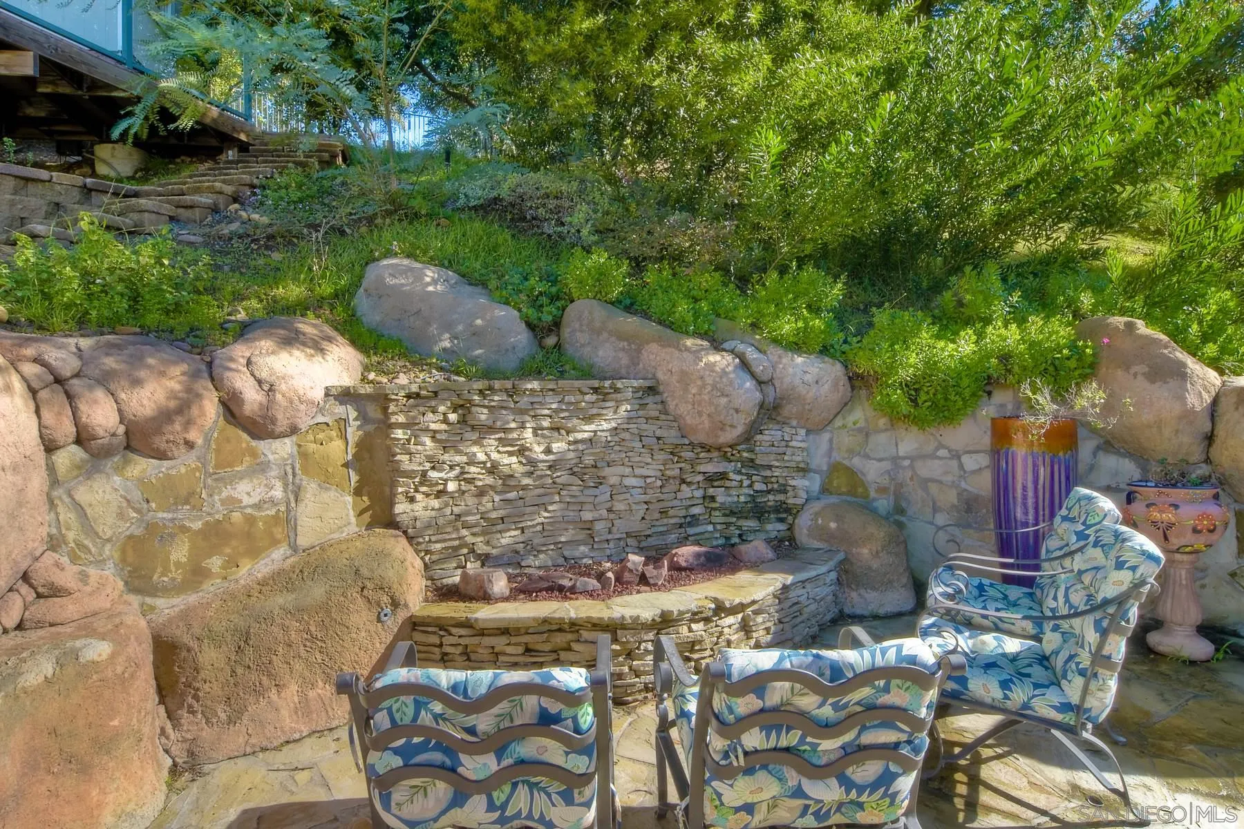 11739 Treadwell Drive Poway, CA 92064 - Photo 41 of 46 a view of a backyard with table and chairs potted plants and large tree