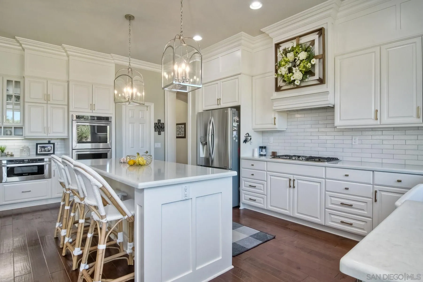 11739 Treadwell Drive Poway, CA 92064 - Photo 5 of 46 a kitchen with stainless steel appliances granite countertop a sink a stove a refrigerator and cabinets