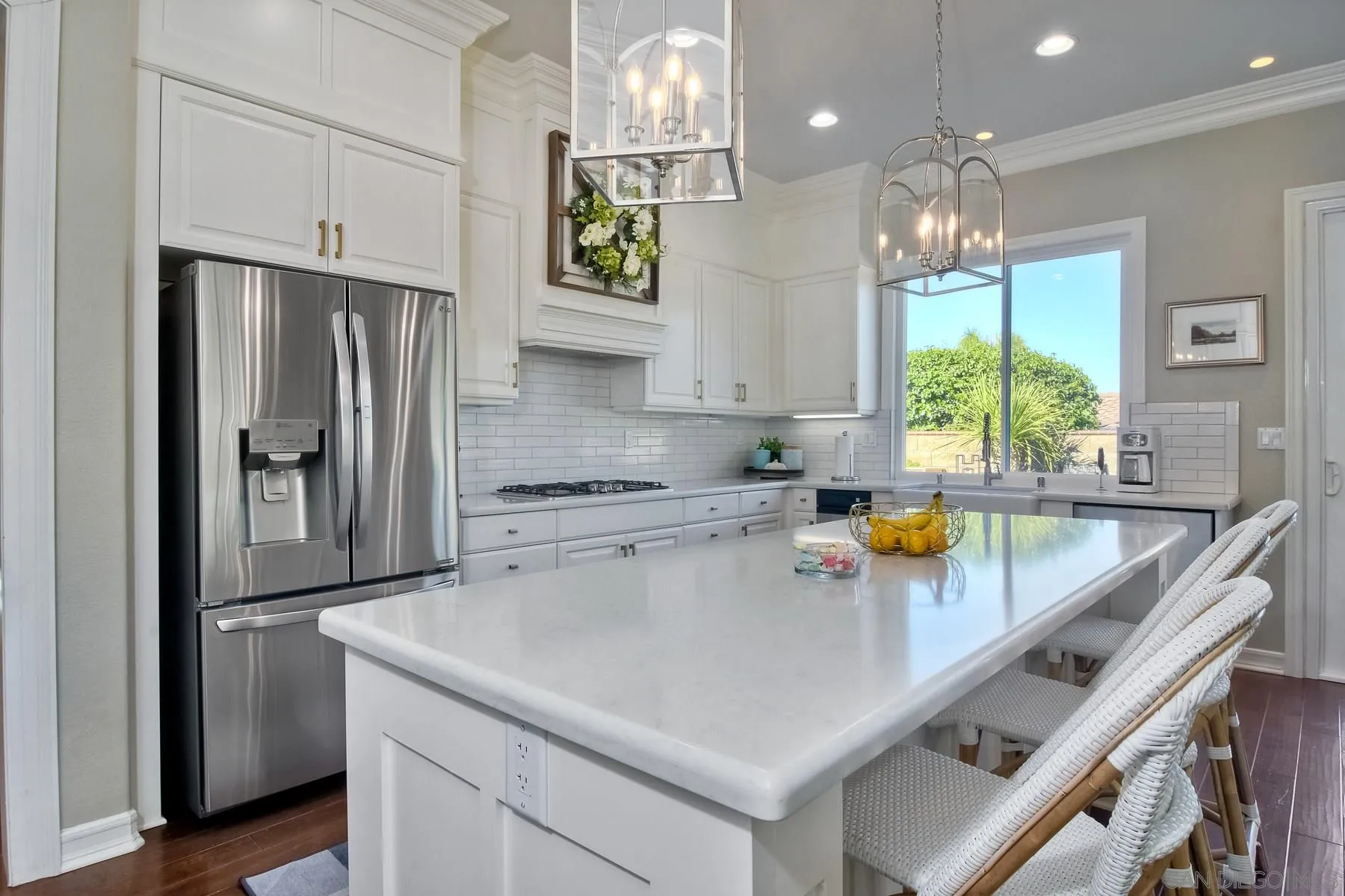 11739 Treadwell Drive Poway, CA 92064 - Photo 6 of 46 a kitchen that has a lot of cabinets a sink and appliances in it