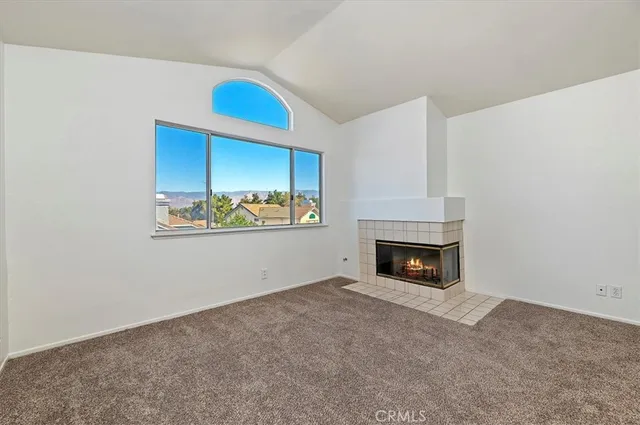 a bathroom with a granite countertop sink a mirror and shower