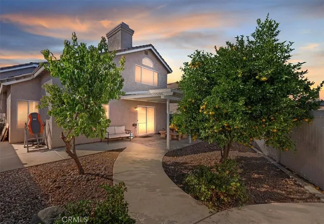 a front view of a house with garden