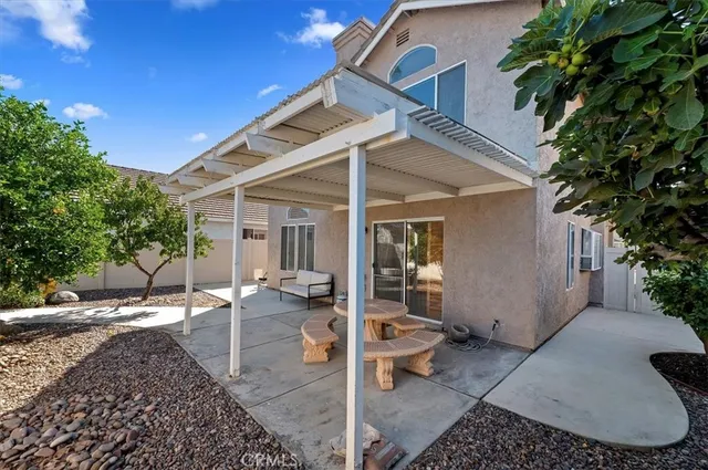 a view of a house with a yard and plants
