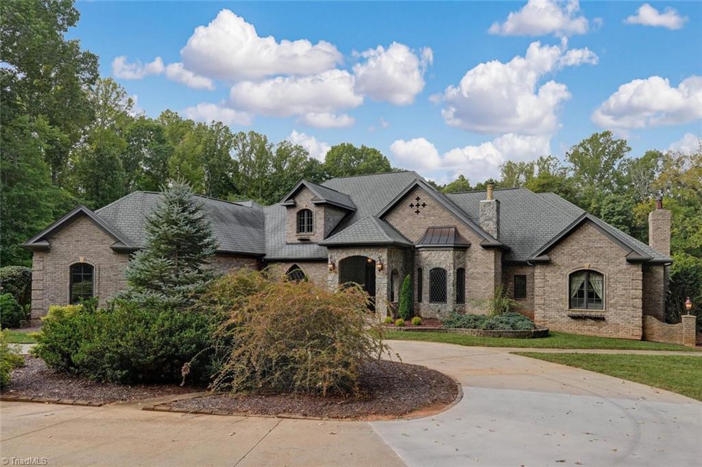 7809 Gold Ridge Road Oak Ridge, NC 27310 - Photo 1 of 50 HOME IS PERFECTLY SITUATED WITH PRIVACY AND A CIRCULAR DRIVE