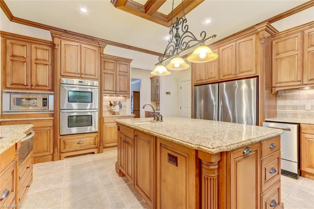 7809 Gold Ridge Road Oak Ridge, NC 27310 - Photo 13 of 50 DUAL OVENS, ICEMAKER AND WARMING DRAWER ARE JUST A FEW OF THE APPLIANCES IN THIS CHEF'S KITCHEN