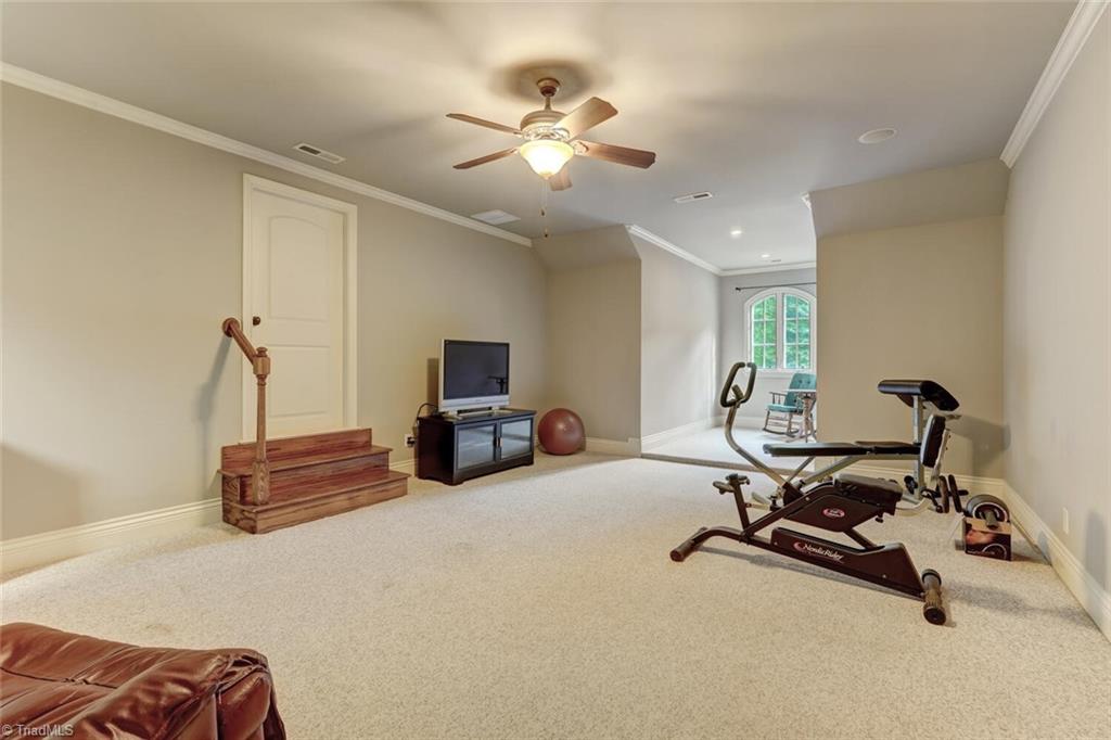7809 Gold Ridge Road Oak Ridge, NC 27310 - Photo 30 of 50 THE IN-LAW SUITE IS CURRENTLY USED AS AN EXERCISE AREA WITH LARGE WALK IN CLOSET