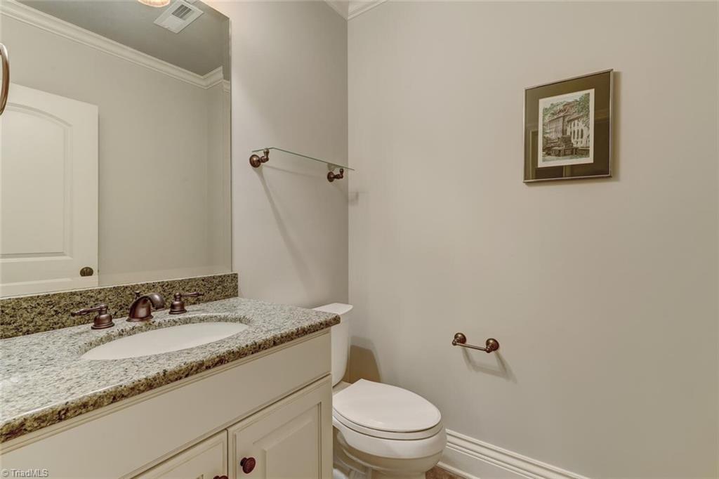 7809 Gold Ridge Road Oak Ridge, NC 27310 - Photo 36 of 50 A HALF BATH SERVES THE LOWER LEVEL OF THE HOME