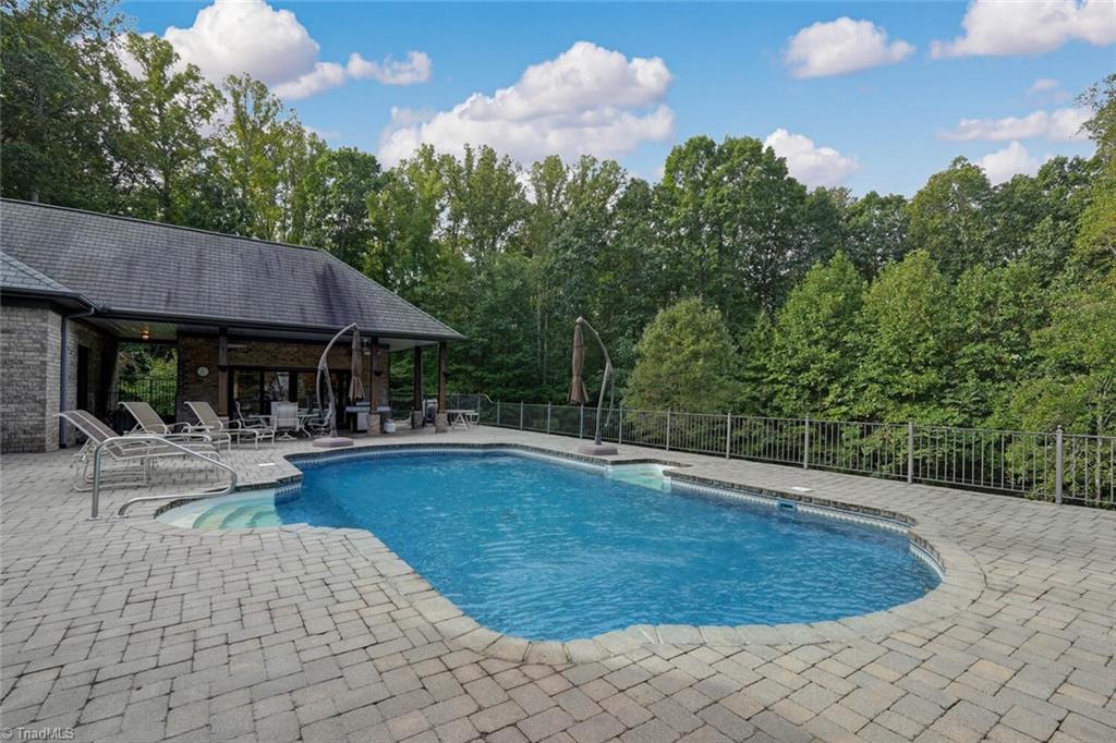 7809 Gold Ridge Road Oak Ridge, NC 27310 - Photo 38 of 50 IMAGINE THOSE HOT SUMMER DAYS LOUNGING BY YOUR OWN IN-GROUND POOL!