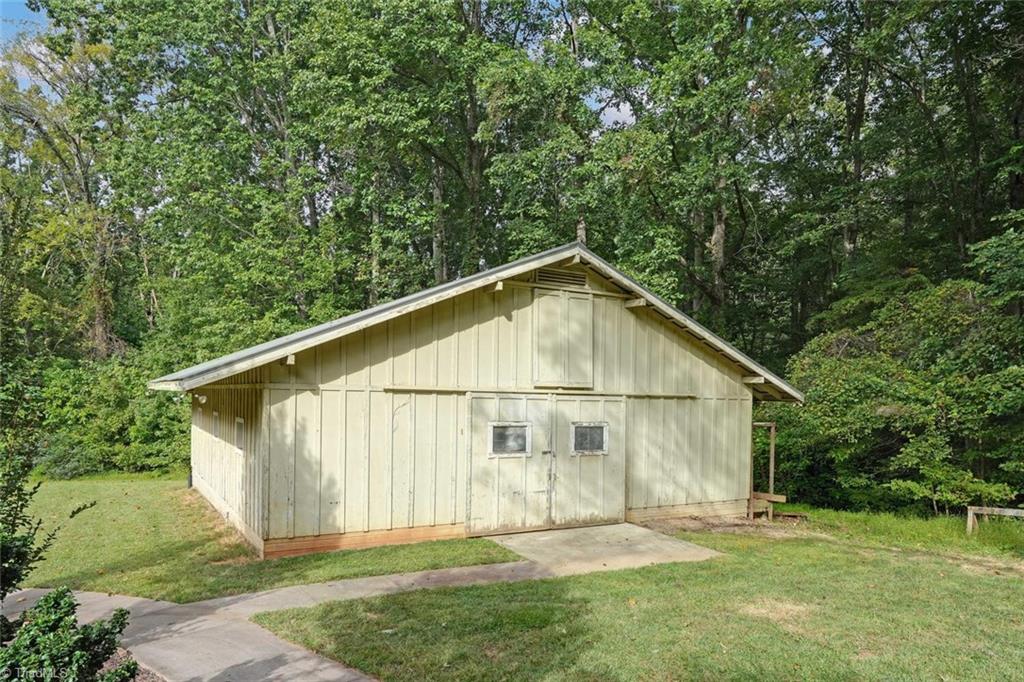 7809 Gold Ridge Road Oak Ridge, NC 27310 - Photo 44 of 50 THERE'S EVEN A BARN WITH A TACK ROOM AND HORSE STALL ON THIS PROPERTY - BRING YOUR HORSE! SELLER IS USING THIS FOR GENERAL STORAGE AT THIS TIME.