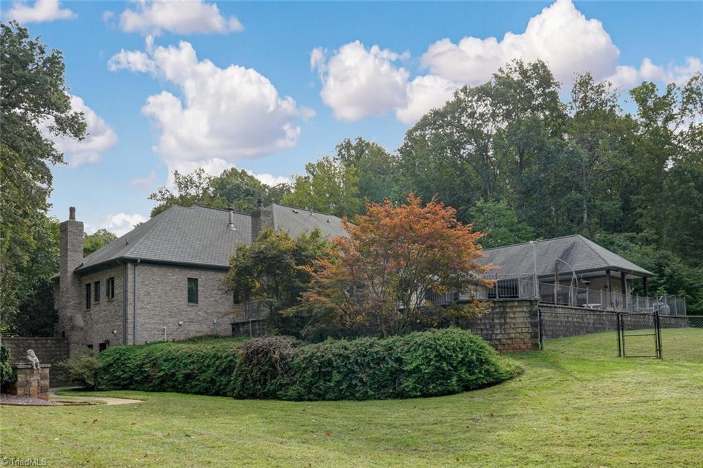 7809 Gold Ridge Road Oak Ridge, NC 27310 - Photo 45 of 50 VIEW OF THE REAR OF THE HOME AND YARD
