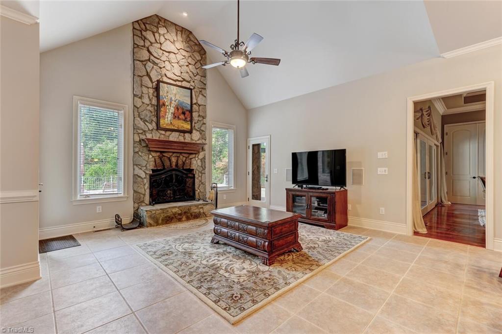 7809 Gold Ridge Road Oak Ridge, NC 27310 - Photo 10 of 50 THE KEEPING ROOM HAS A VAULTED CEILING AND FIREPLACE