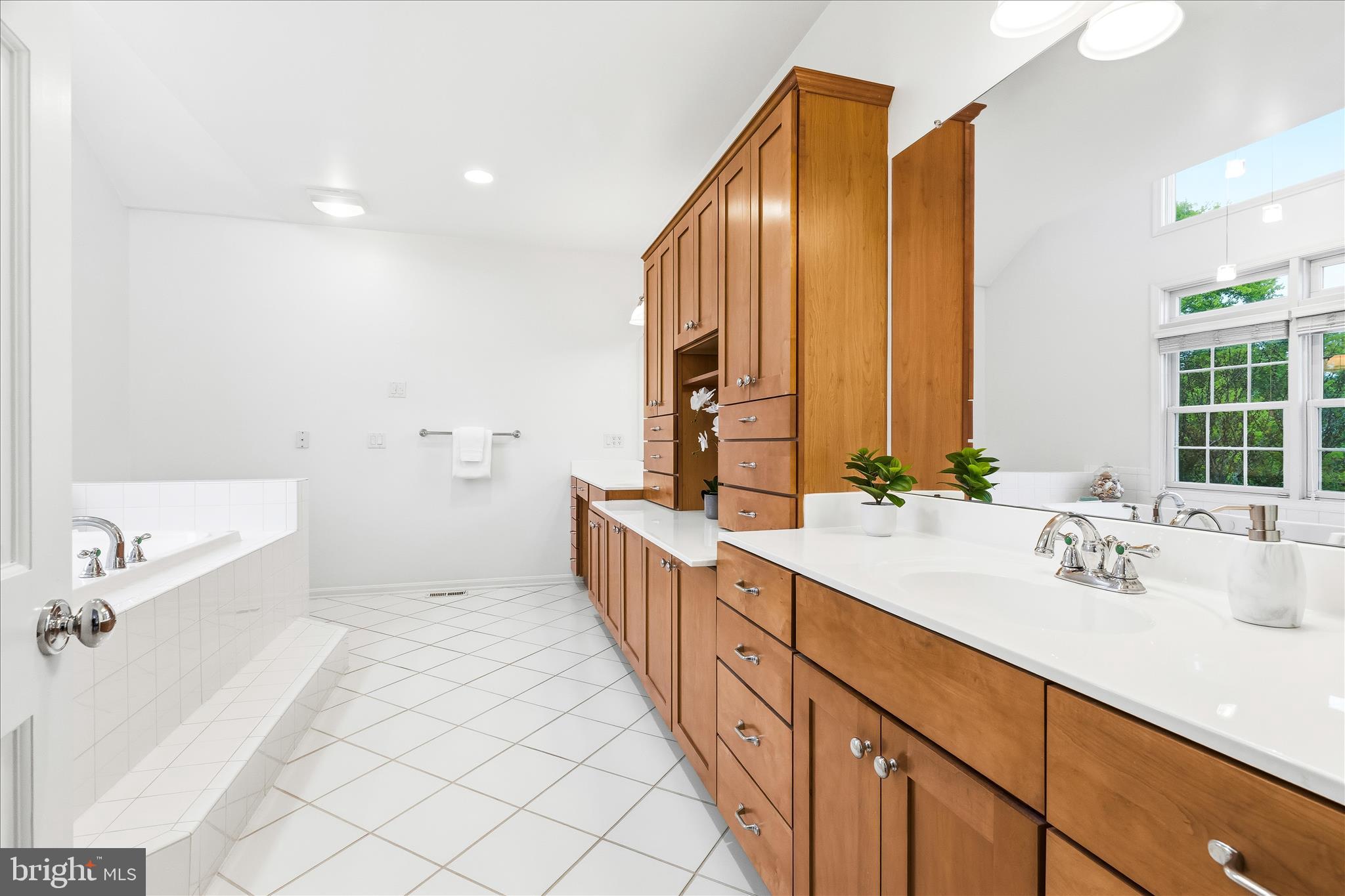 10691 Easterday Road Myersville, MD 21773 - Photo 28 of 79 a spacious bathroom with a double vanity sink mirror and double