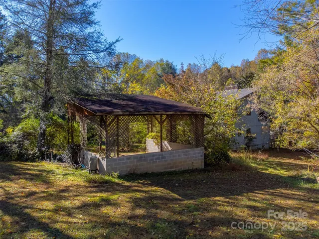 a view of a backyard with sitting area