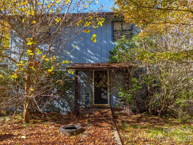 a view of residential house with green space