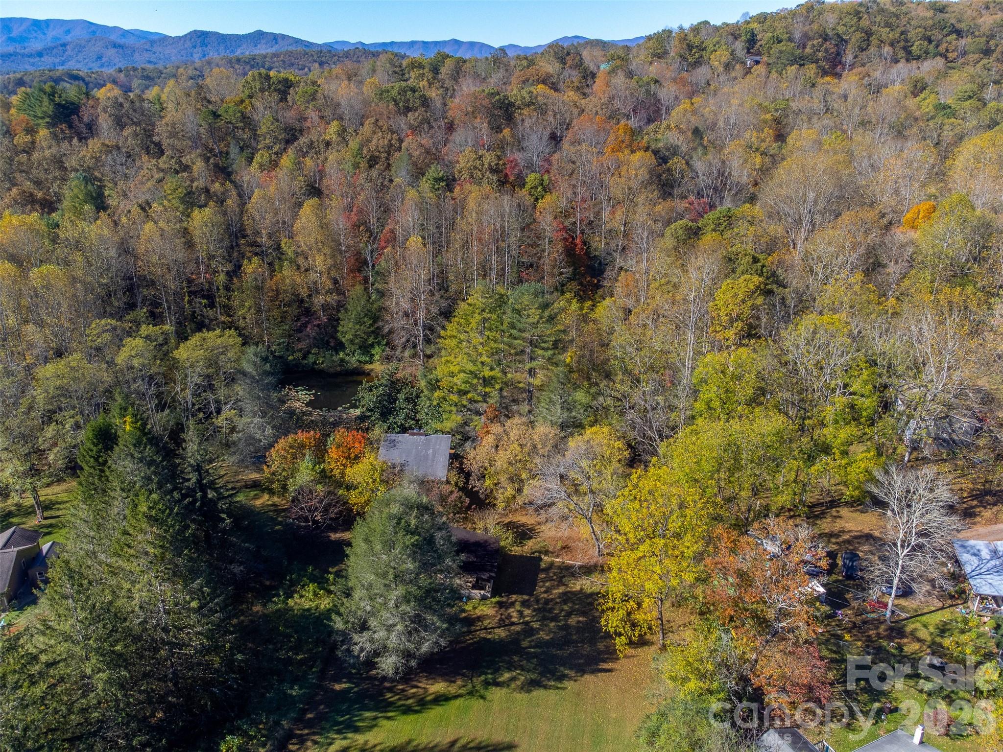 120 Trimont Trail Franklin, NC 28734 - Photo 27 of 33 a view of a houses with a lush green forest