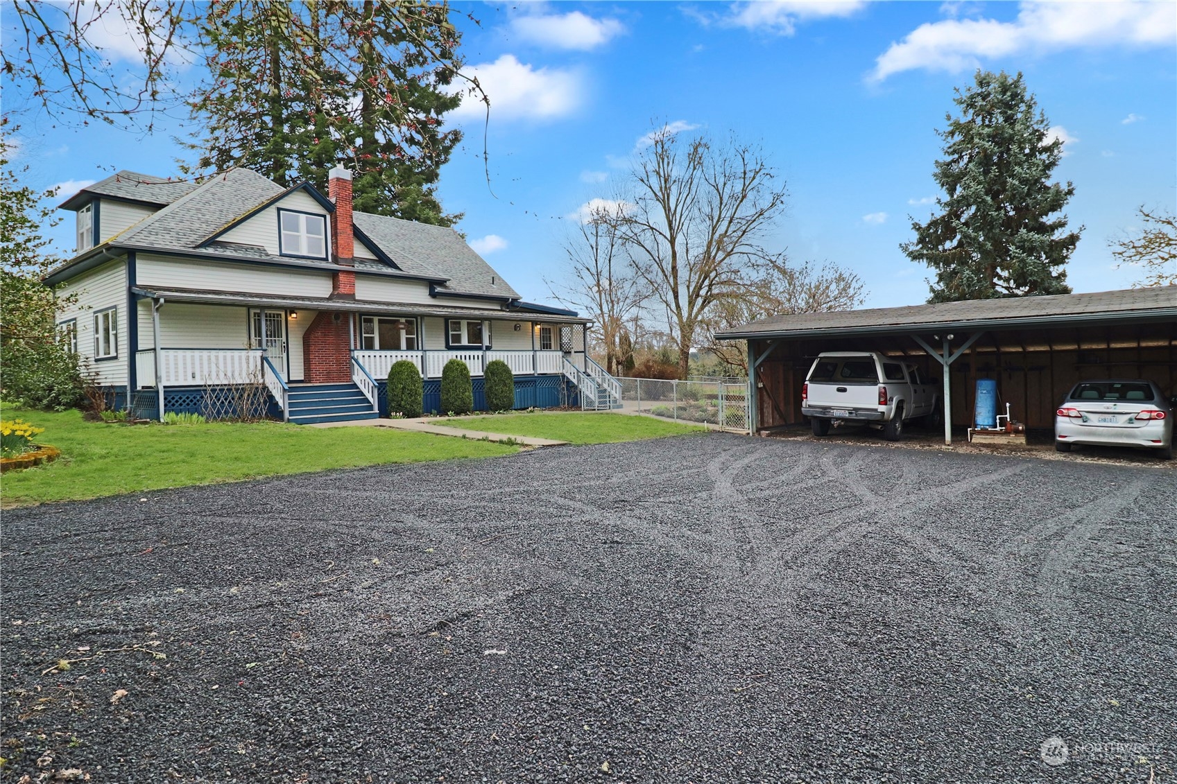 203 Stearns Road Chehalis, WA 98532 - Photo 1 of 34 a view of a house with a yard and potted plants