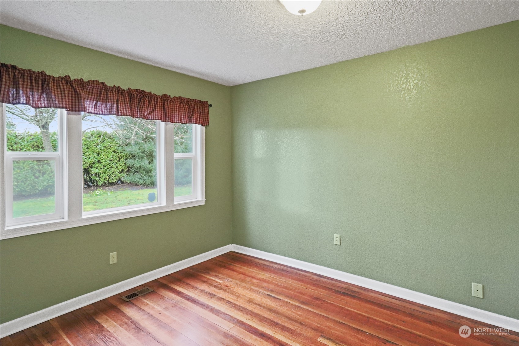 203 Stearns Road Chehalis, WA 98532 - Photo 12 of 34 a view of a room with wooden floor and a window