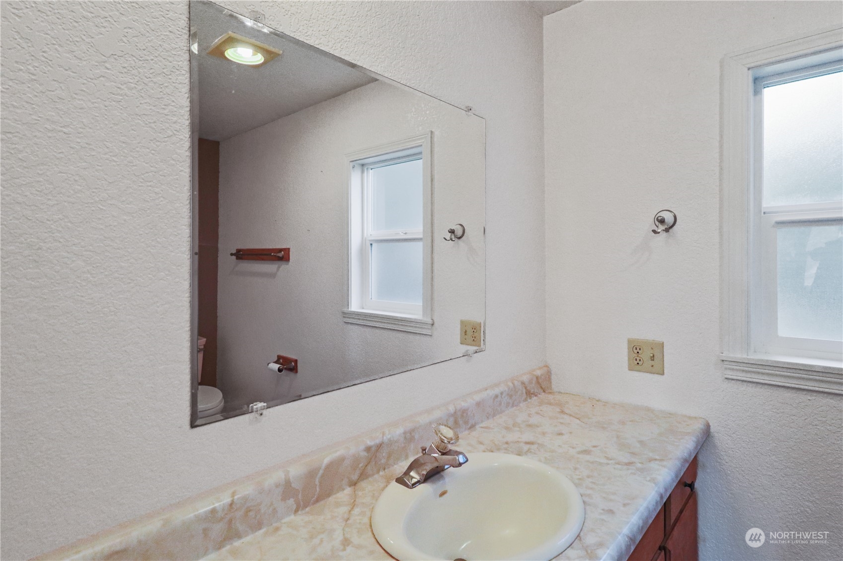 203 Stearns Road Chehalis, WA 98532 - Photo 14 of 34 a bathroom with a granite countertop sink and mirror with window