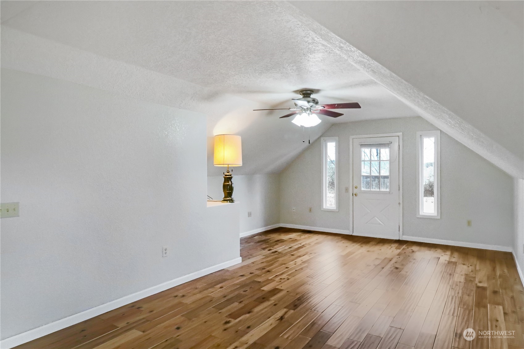 203 Stearns Road Chehalis, WA 98532 - Photo 17 of 34 a view of an empty room with wooden floor and a window