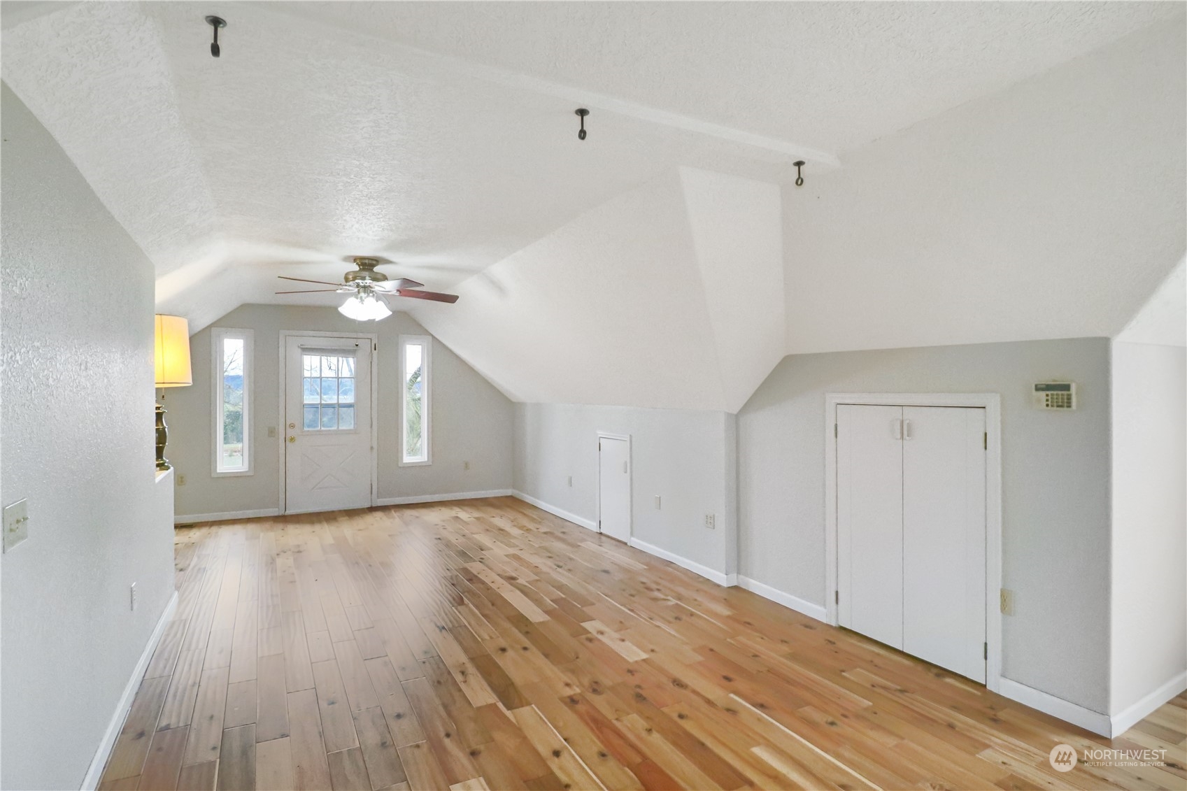 203 Stearns Road Chehalis, WA 98532 - Photo 18 of 34 a view of an empty room with window and wooden floor