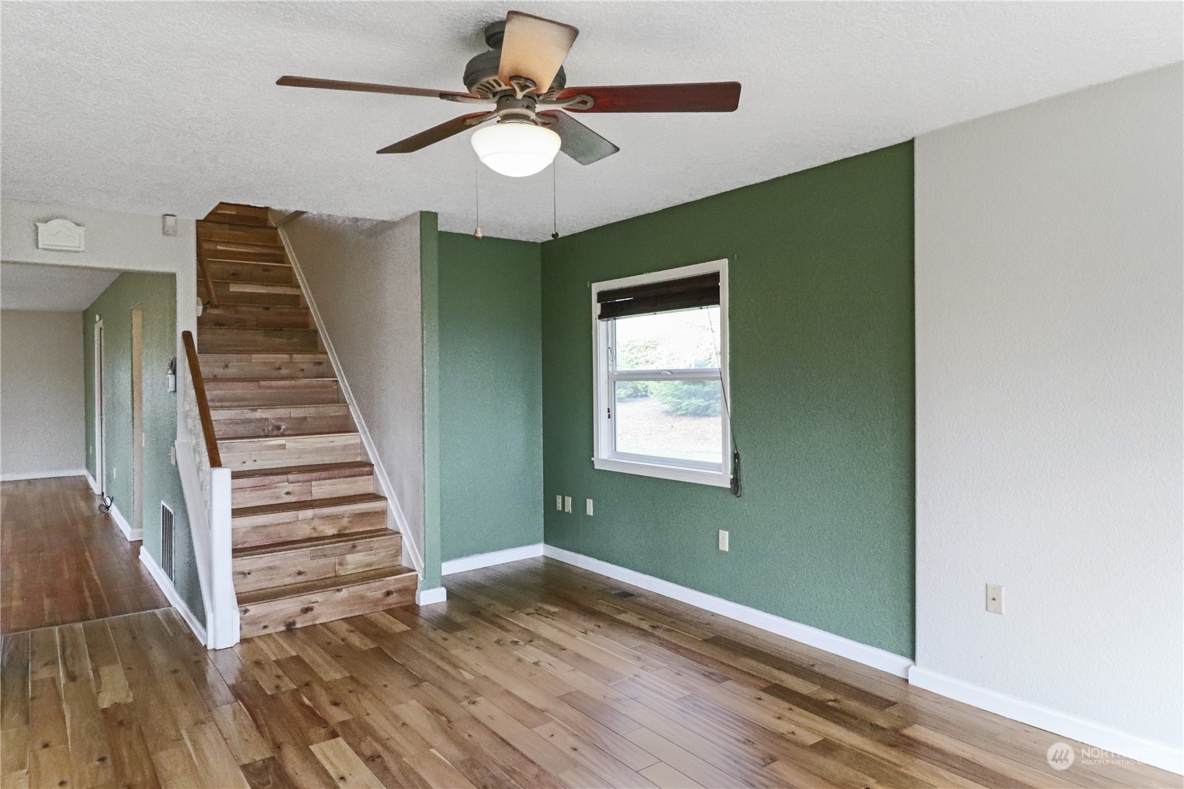 203 Stearns Road Chehalis, WA 98532 - Photo 9 of 34 wooden floor in an empty room with a window