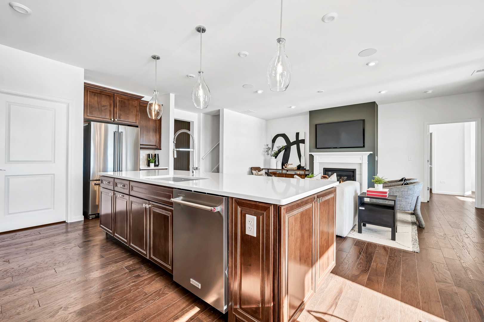 3256 Oak Creek Lane Aurora, IL 60503 - Photo 3 of 19 a kitchen with stainless steel appliances granite countertop a sink a stove and a wooden floors