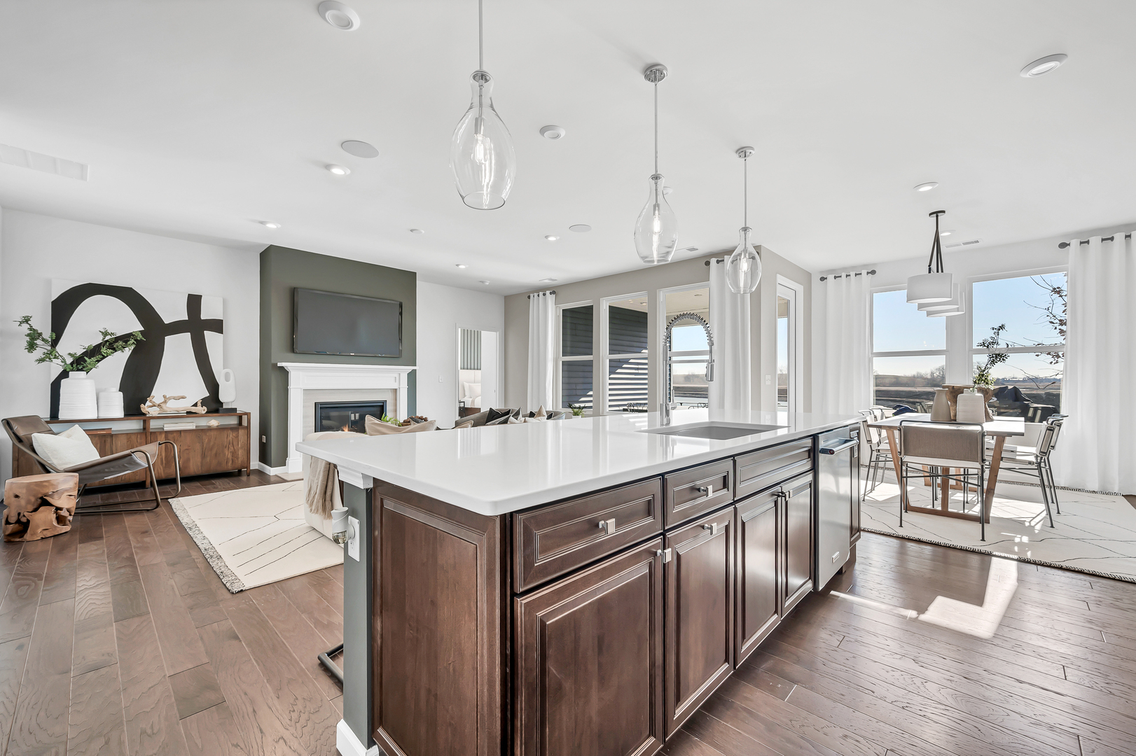 3256 Oak Creek Lane Aurora, IL 60503 - Photo 4 of 19 a large kitchen with kitchen island a large counter space a sink appliances and living room view