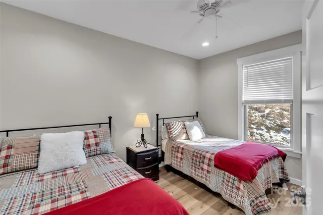 a bedroom with a bed and a lamp