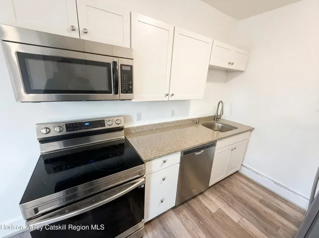 a kitchen with a stove and a microwave