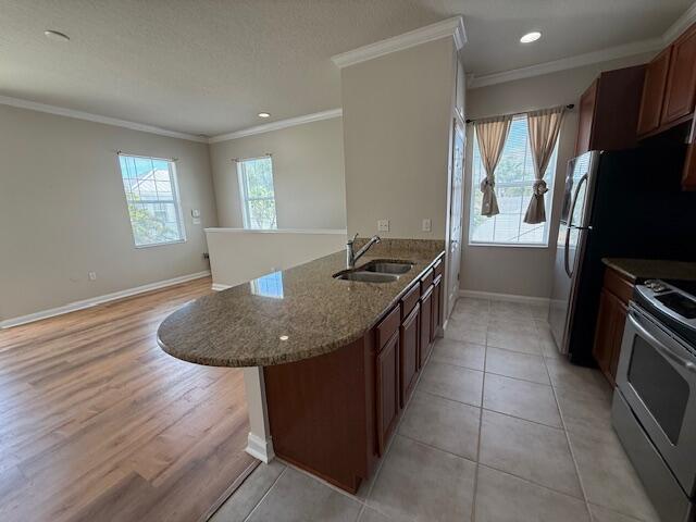 1382 Dakota Drive, Unit 2 Jupiter, FL 33458 - Photo 11 of 17 a kitchen with granite countertop a sink a counter top space and stainless steel appliances