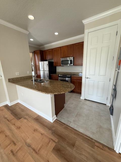 1382 Dakota Drive, Unit 2 Jupiter, FL 33458 - Photo 10 of 17 a large kitchen with a stove a sink and a refrigerator