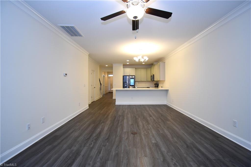 2270 Willard Dairy Road High Point, NC 27265 - Photo 12 of 28 A view from in front of the fire place back to the kitchen.