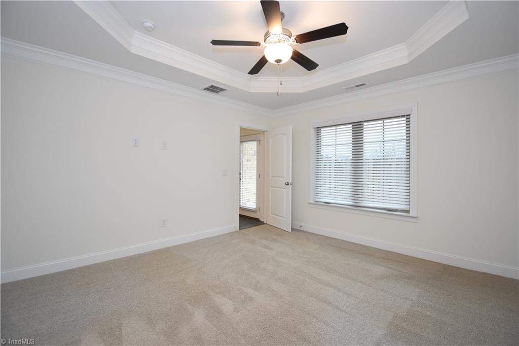 2270 Willard Dairy Road High Point, NC 27265 - Photo 15 of 28 A second view of our primary bedroom looking out towards the back patio (enclosed)