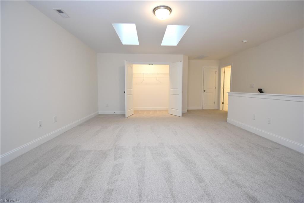2270 Willard Dairy Road High Point, NC 27265 - Photo 22 of 28 The loft features a large closet to store all those extra items.