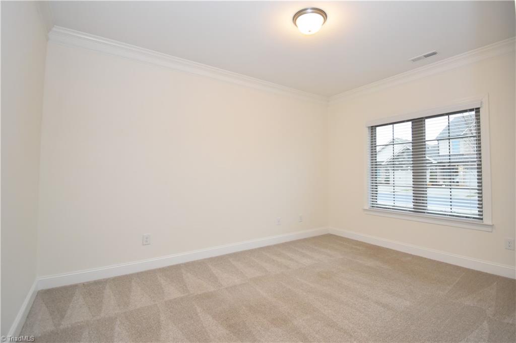 2270 Willard Dairy Road High Point, NC 27265 - Photo 3 of 28 First floor guest bedroom or a private office. The closet is just off to our left out of frame.