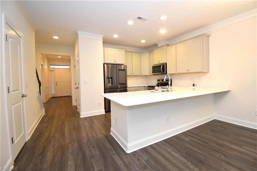 2270 Willard Dairy Road High Point, NC 27265 - Photo 7 of 28 A view looking from the hall way back towards the kitchen and front door. Look at all that prep and storage space.
