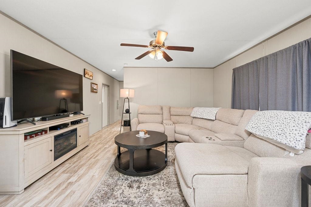 271 Clements Way Fruita, CO 81521 - Photo 3 of 26 a living room with furniture and a flat screen tv