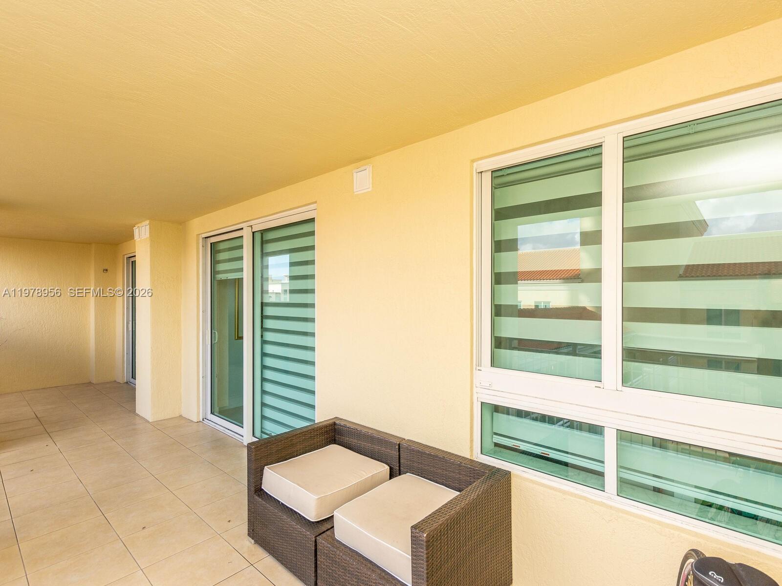 7350 Southwest 89th Street, Unit 719S Miami, FL 33156 - Photo 27 of 30 a view of a room with furniture and a window