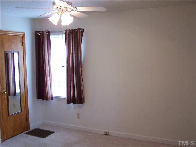 8520 Fayetteville Road Raleigh, NC 27603 - Photo 16 of 25 Master bedroom with walk-in closet