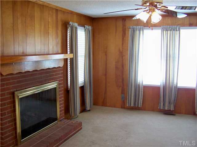 8520 Fayetteville Road Raleigh, NC 27603 - Photo 3 of 25 Family room with masonry fireplace, gas logs, blower.